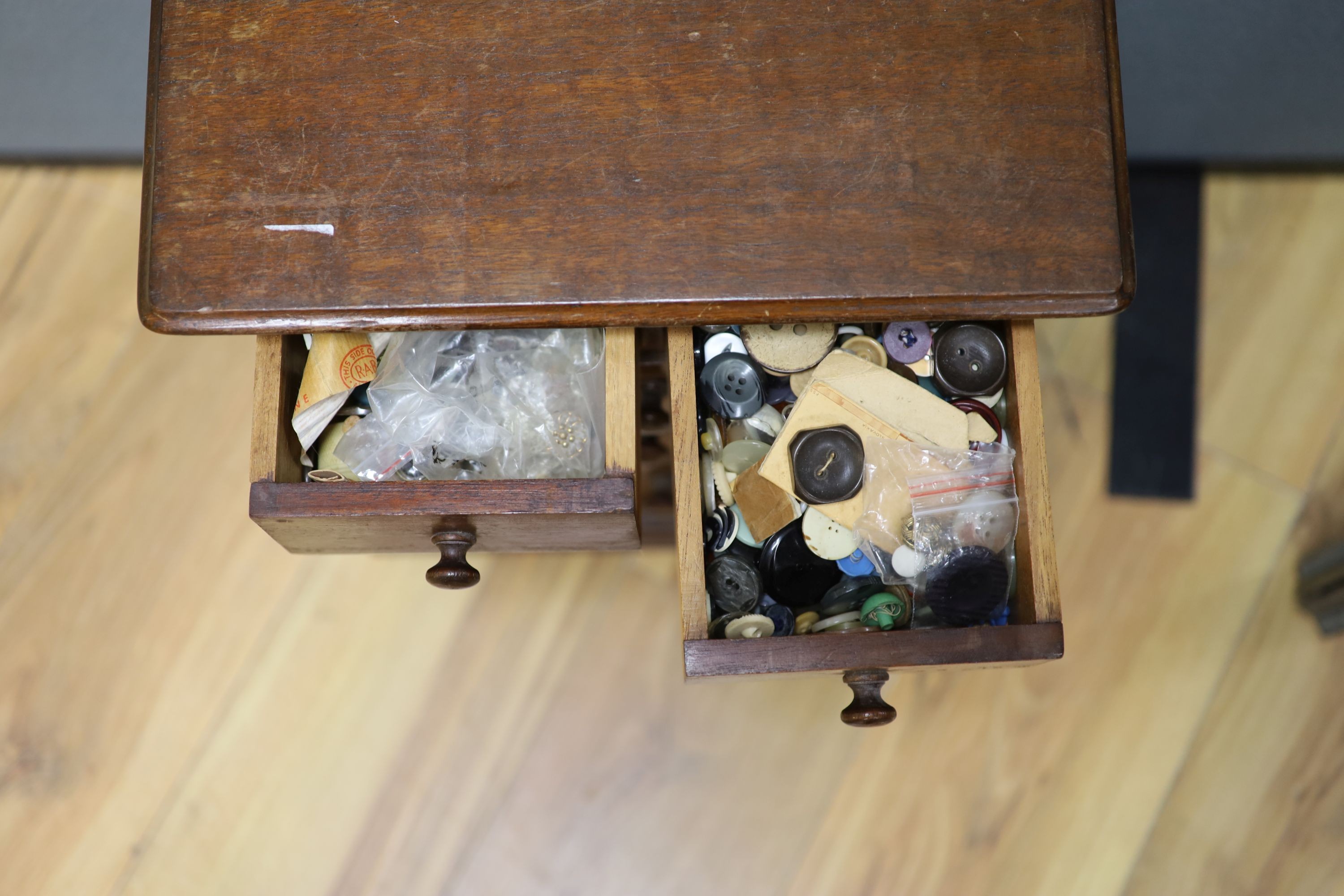 An early 20th century miniature chest and contents